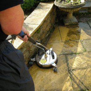 Patio edge cleaning action shot